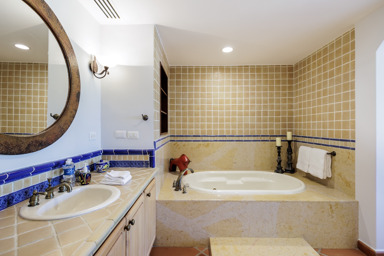 Relax in your private spa-like bathroom featuring a soaking tub, handcrafted Mexican tile, and coastal elegance. Soft towels and thoughtful touches await your arrival.