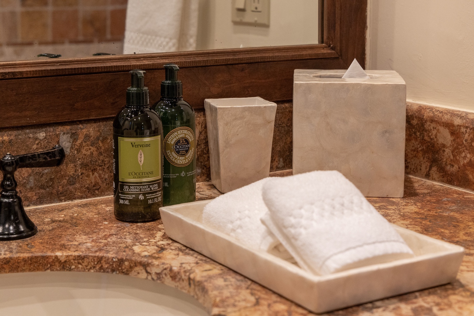 Your bathroom features upscale L'Occitane amenities and plush towels, creating a spa-like experience where you can unwind and refresh in comfort.