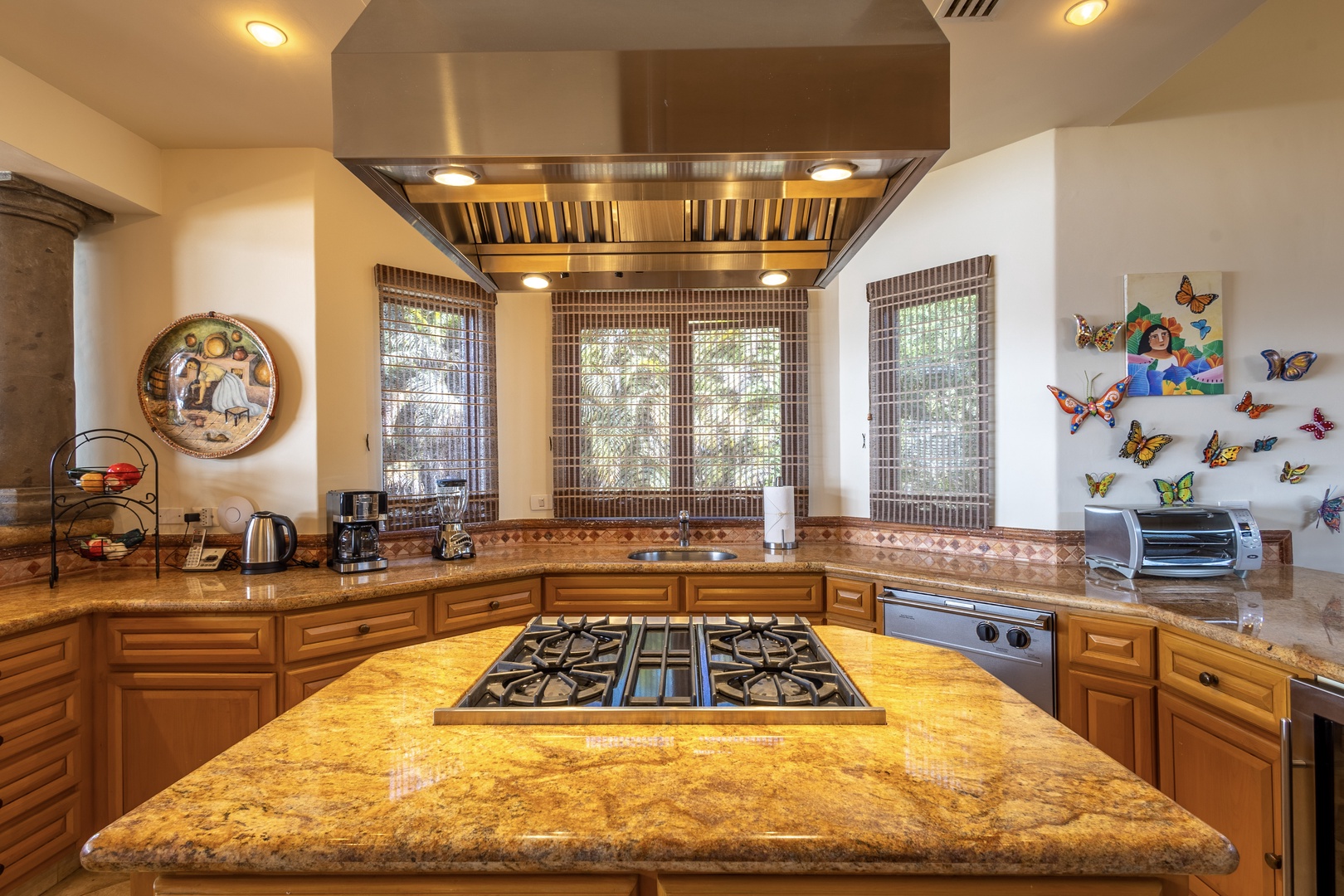 Picture yourself crafting culinary delights in this spacious chef's kitchen, where gleaming granite counters, a professional gas range, and warm wood cabinetry invite your creativity to flourish.