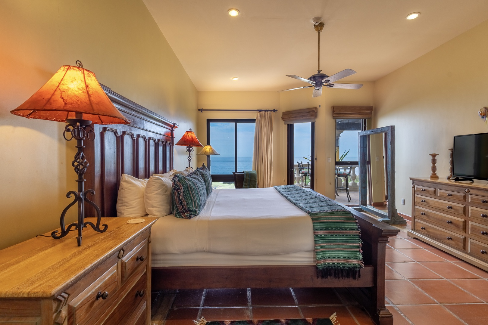 Wake up to the serene blues of the ocean framed by your bedroom windows. This cozy retreat blends rustic warmth with coastal elegance, inviting you to unwind in comfort.