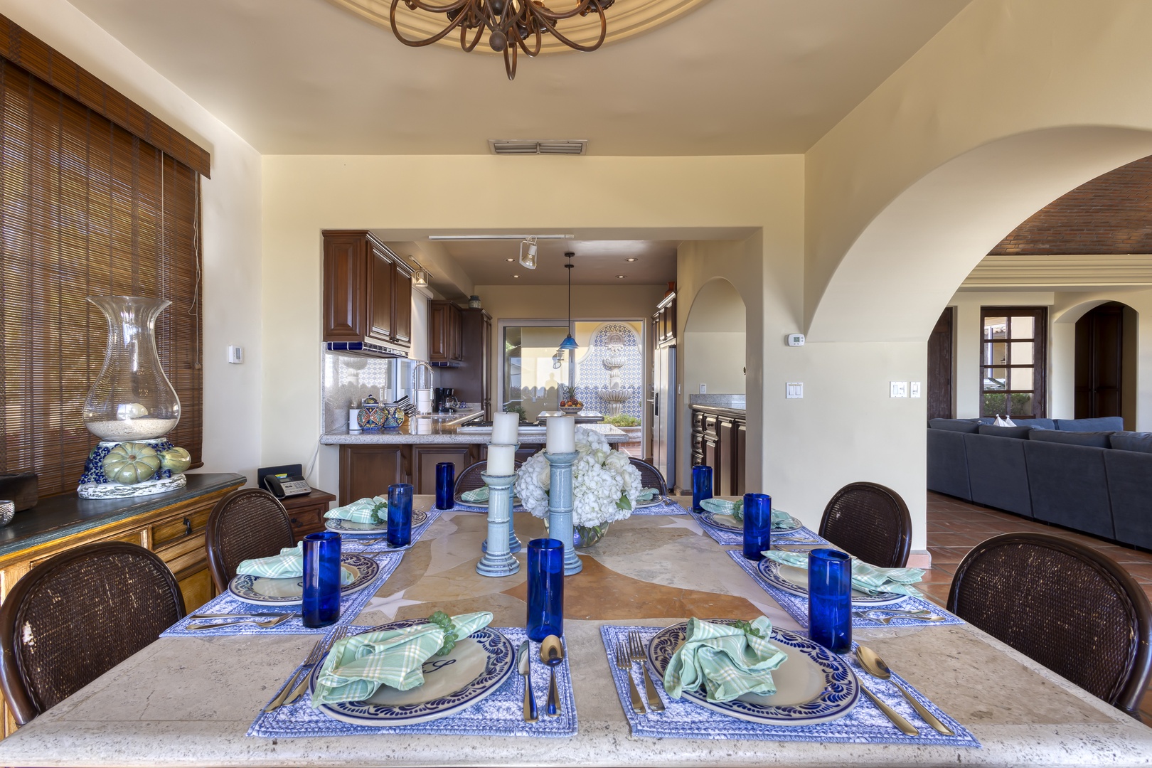 Gather around this elegant dining table where memorable meals await, perfectly positioned between your gourmet kitchen and cozy living space.