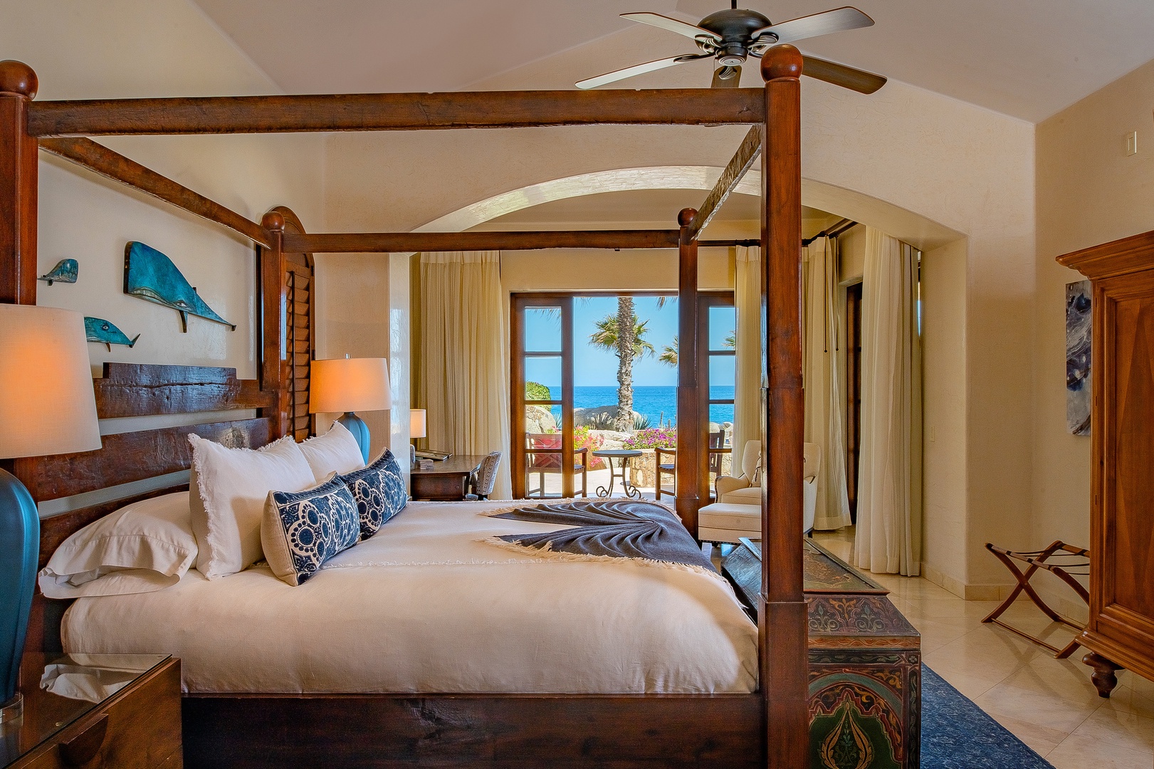 Wake up to stunning ocean views from your elegant four-poster bed, where tropical breezes and coastal serenity create your perfect retreat.