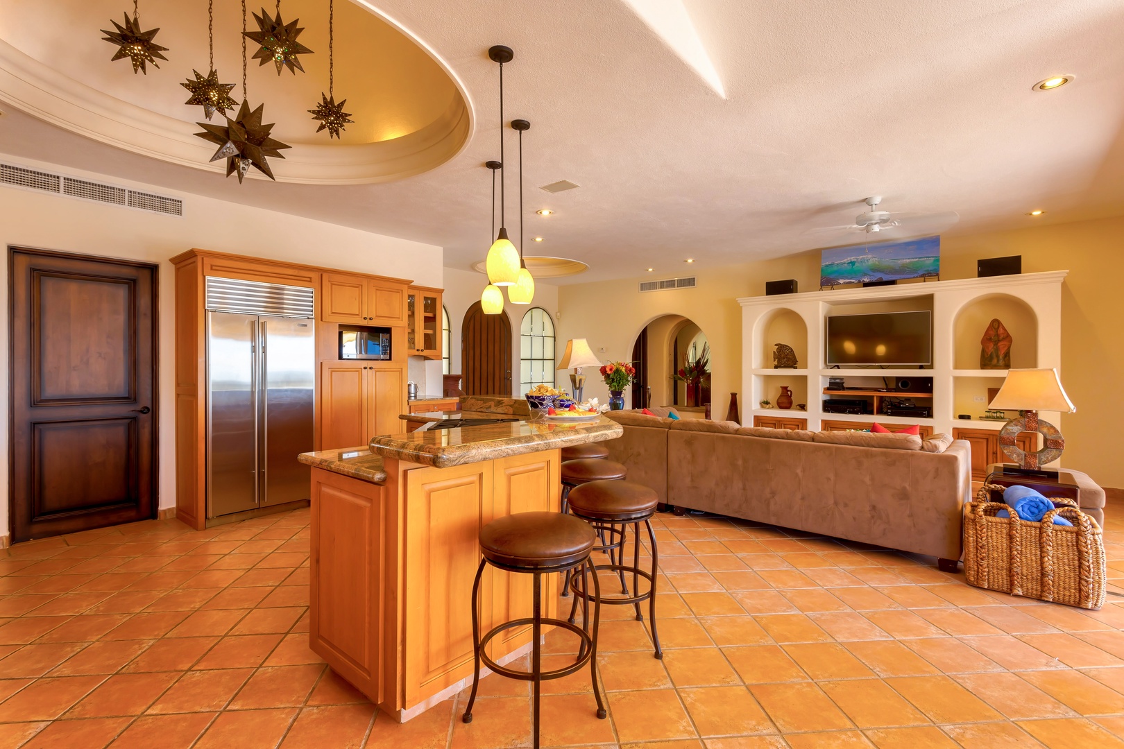 Your gourmet kitchen flows seamlessly into the living space, featuring granite counters and warm pendant lighting for memorable evenings together.