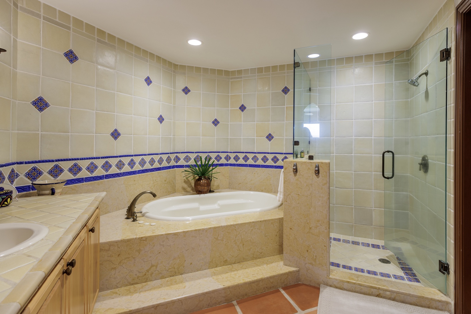 Unwind in your spa-inspired bathroom with a soaking tub and walk-in shower adorned with handcrafted tilework, perfect for relaxing after a day of adventure.