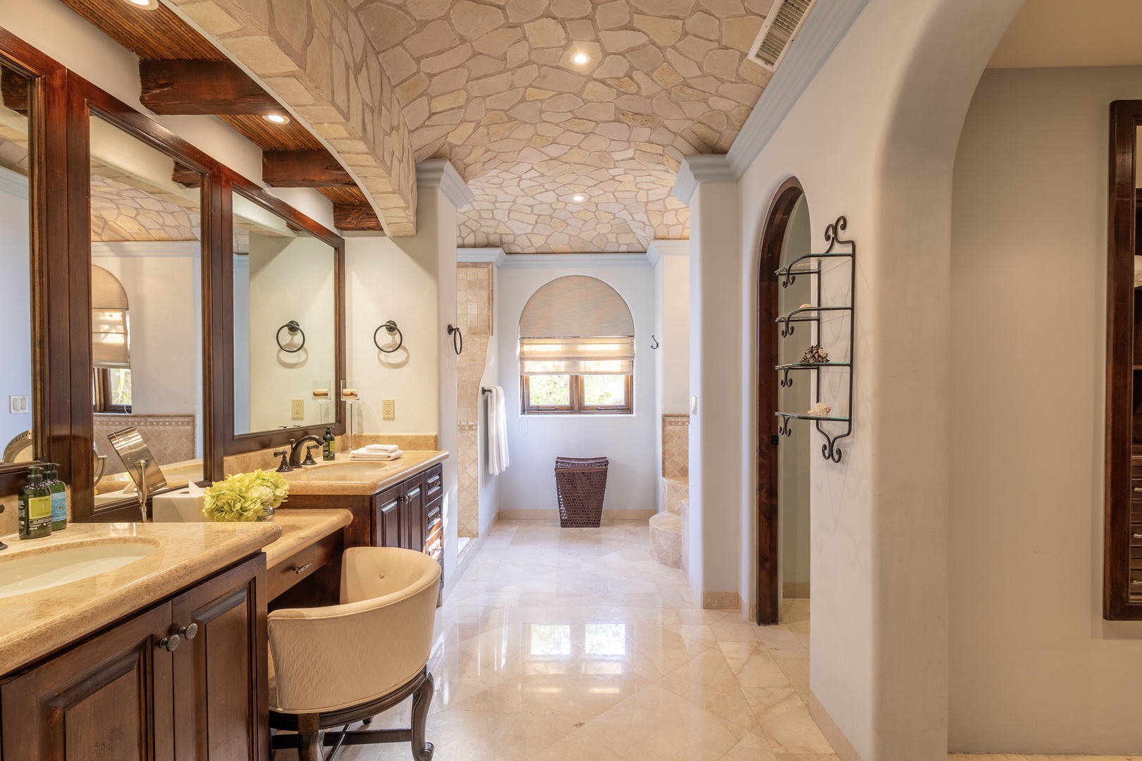 Step into your private spa-like retreat with stunning stone archways, dual vanities, and elegant fixtures. Warm wood accents and radiant floors invite you to unwind in complete luxury.