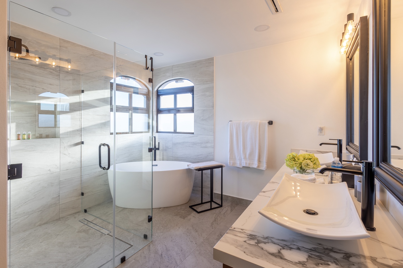 Unwind in your spa-inspired bathroom, where a freestanding tub and spacious walk-in shower invite you to relax. Modern finishes and natural light create a serene retreat.
