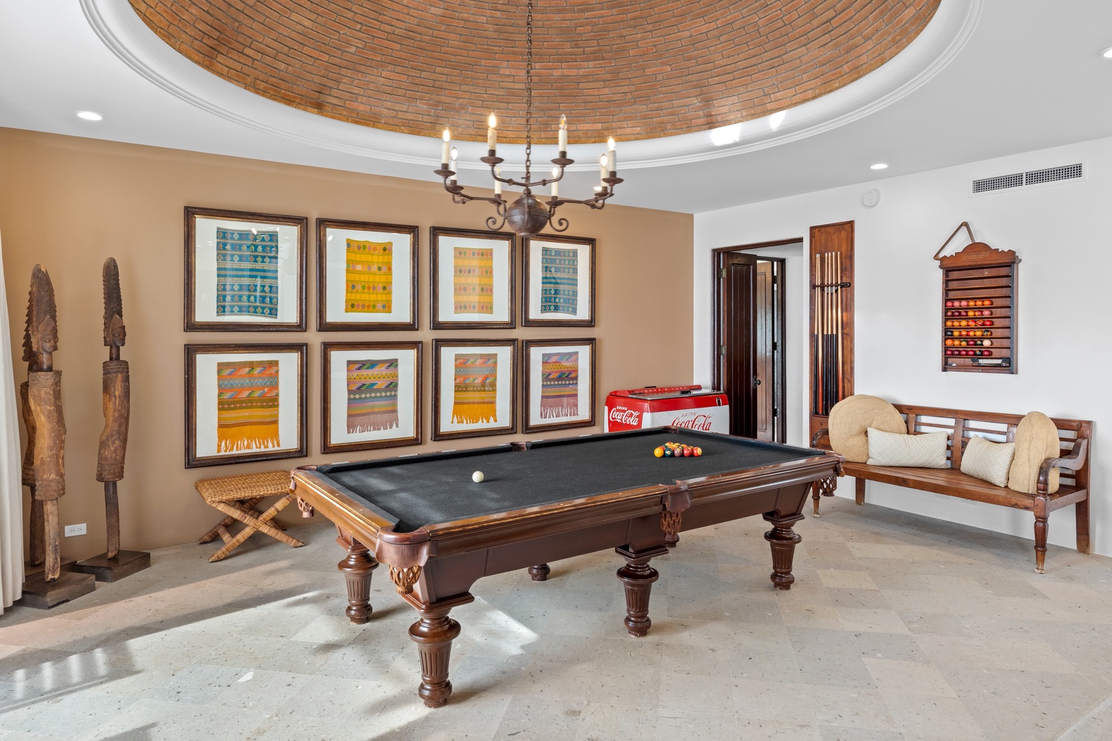 Challenge friends to a game in this elegant billiards room featuring a stunning brick dome ceiling and authentic artwork.