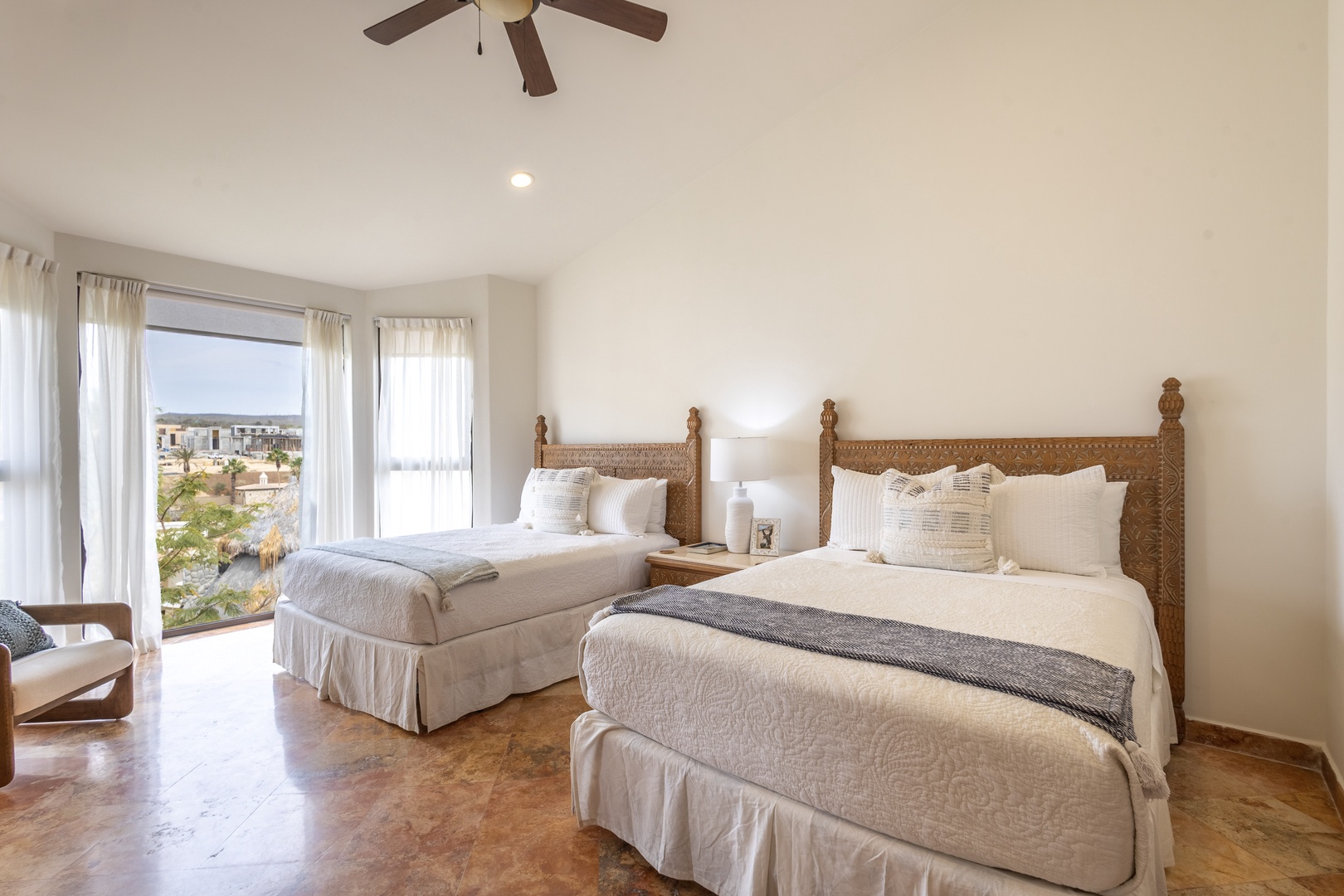 Rest in comfort with two plush beds and wake to stunning city views from your private retreat.