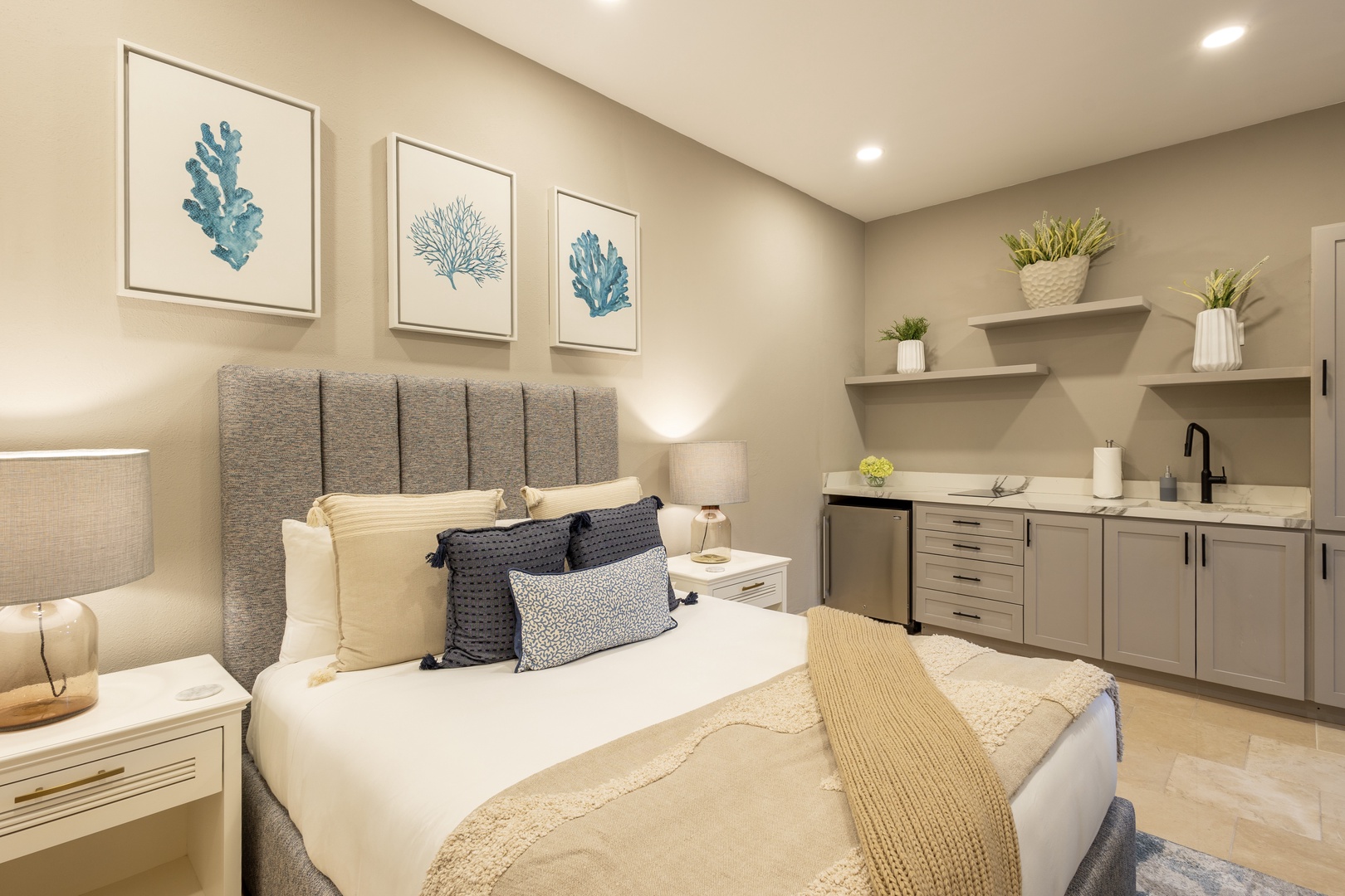 Unwind in your cozy coastal retreat with soothing beach-themed art, plush bedding, and a convenient kitchenette for late-night snacks or morning coffee right at your fingertips.