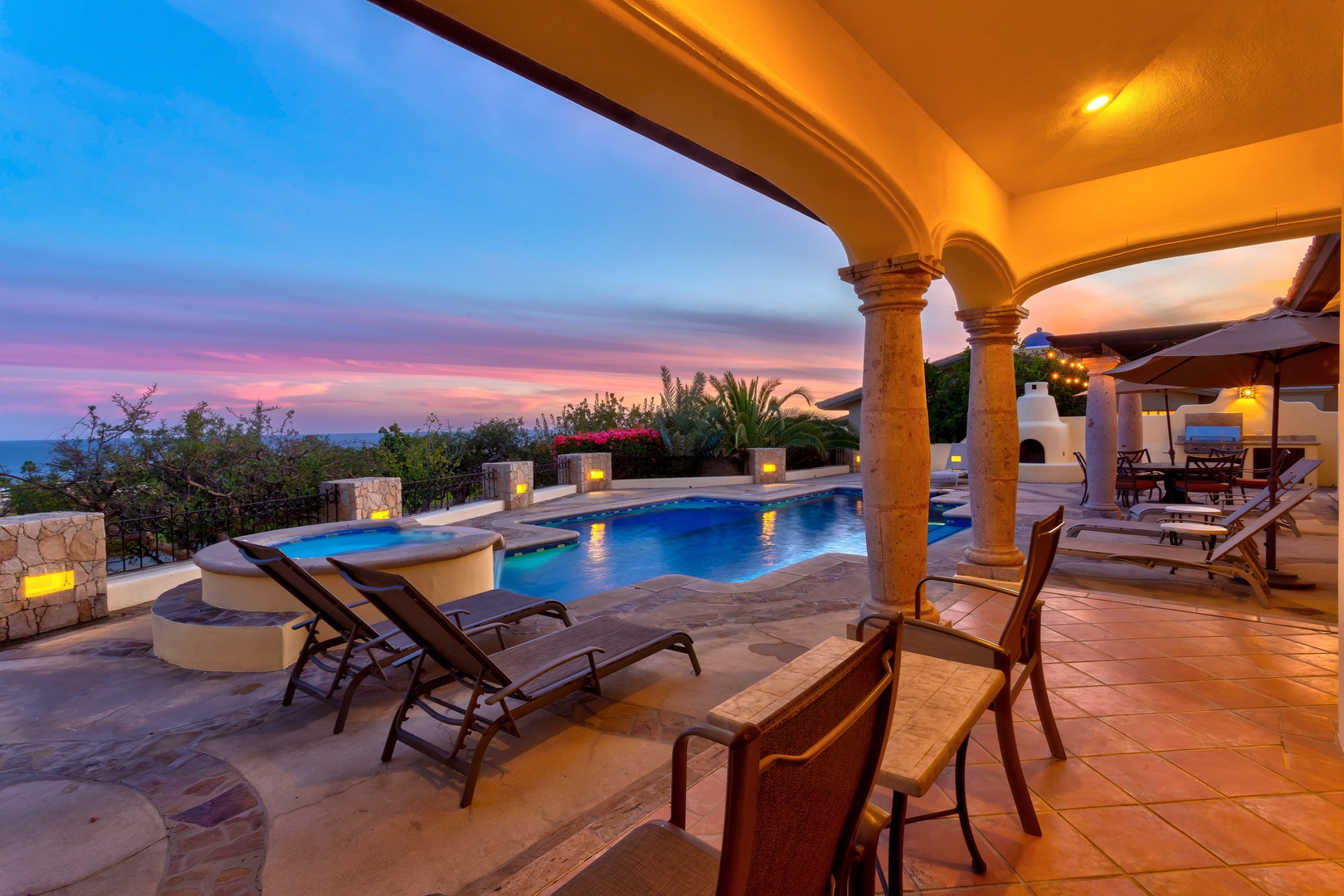 Unwind under elegant arches as you watch the sunset paint the sky in vibrant hues, while your private pool reflects the evening's golden glow.