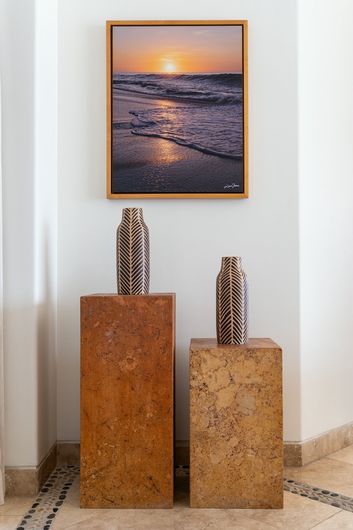 Warm coastal artwork and sculptural accents create a serene corner where you'll appreciate thoughtful design touches throughout your stay.