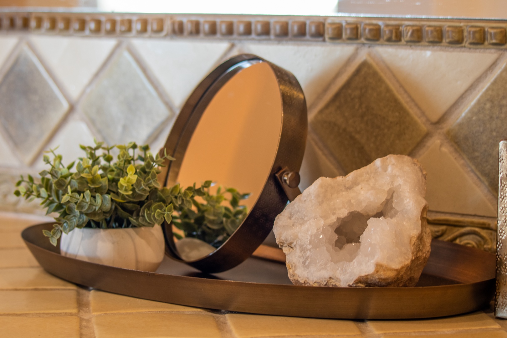 Thoughtful touches await you—a geode, fresh greenery, and a vintage mirror create a serene, welcoming vibe that makes this space feel like home.