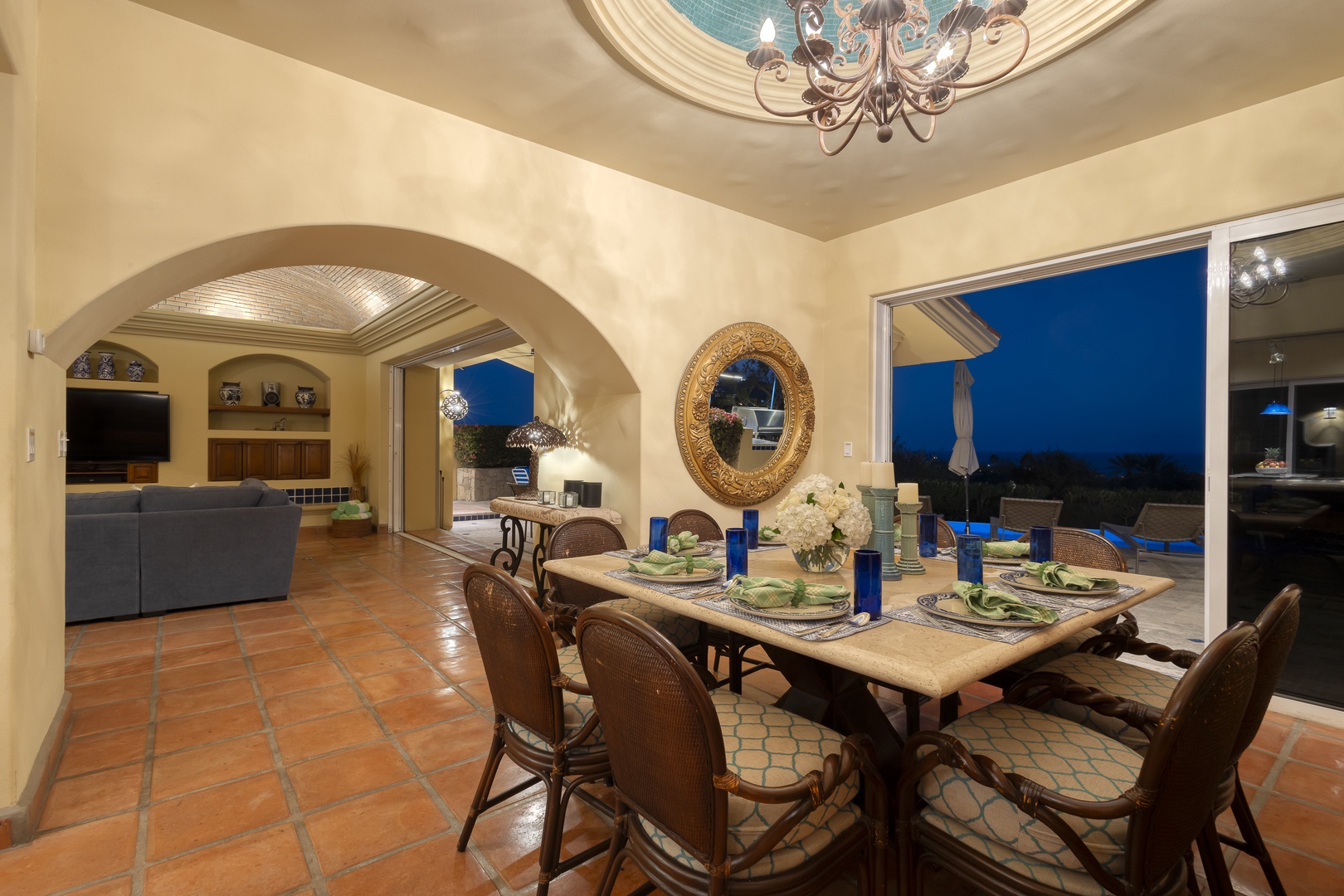 Gather around this elegant dining table where memorable meals unfold under warm lighting, with stunning twilight views creating the perfect backdrop for your evenings.