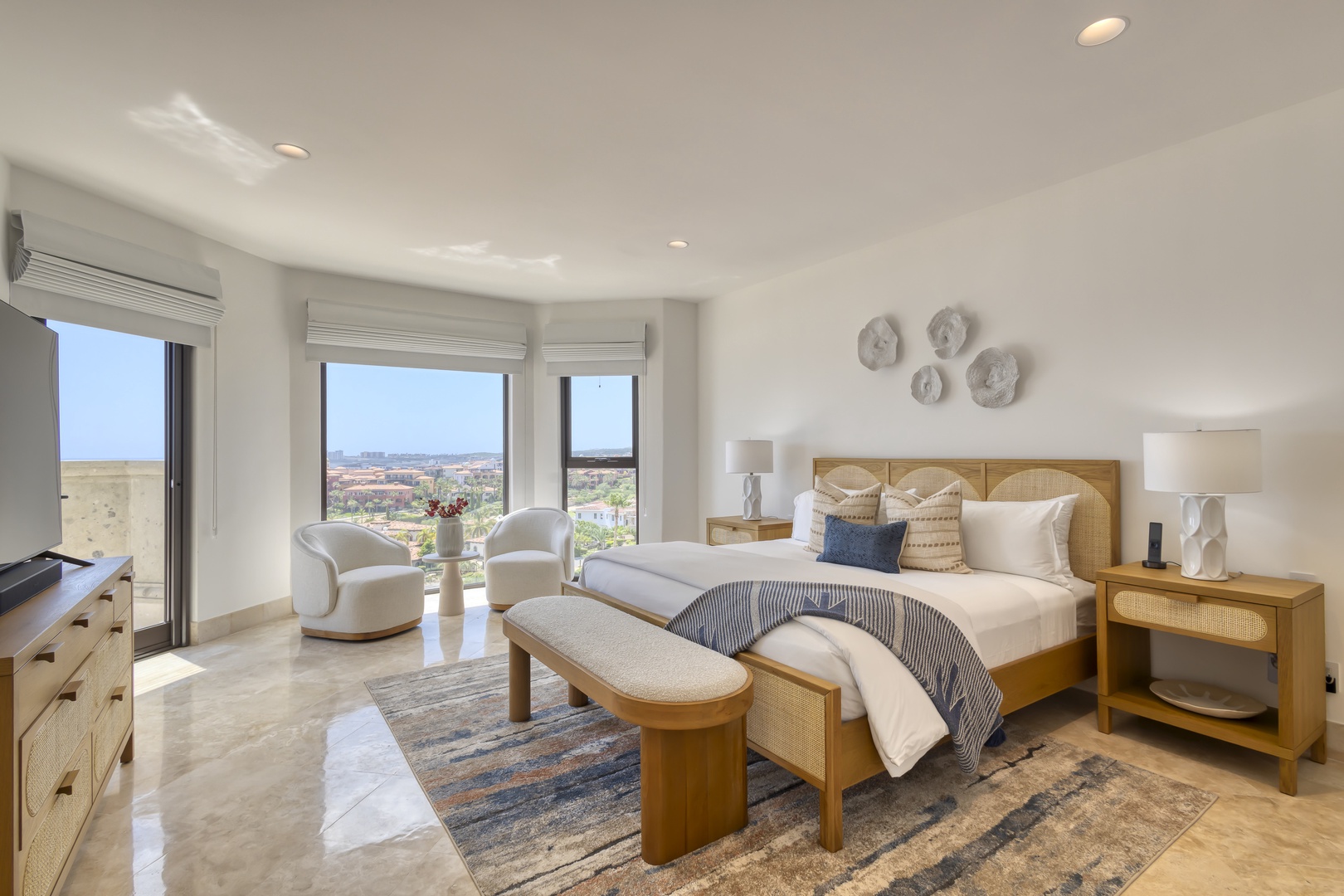 Rest easy in your serene bedroom, where natural light and sweeping views create a peaceful retreat. Sink into the plush bed and enjoy modern comforts like AC and a TV.