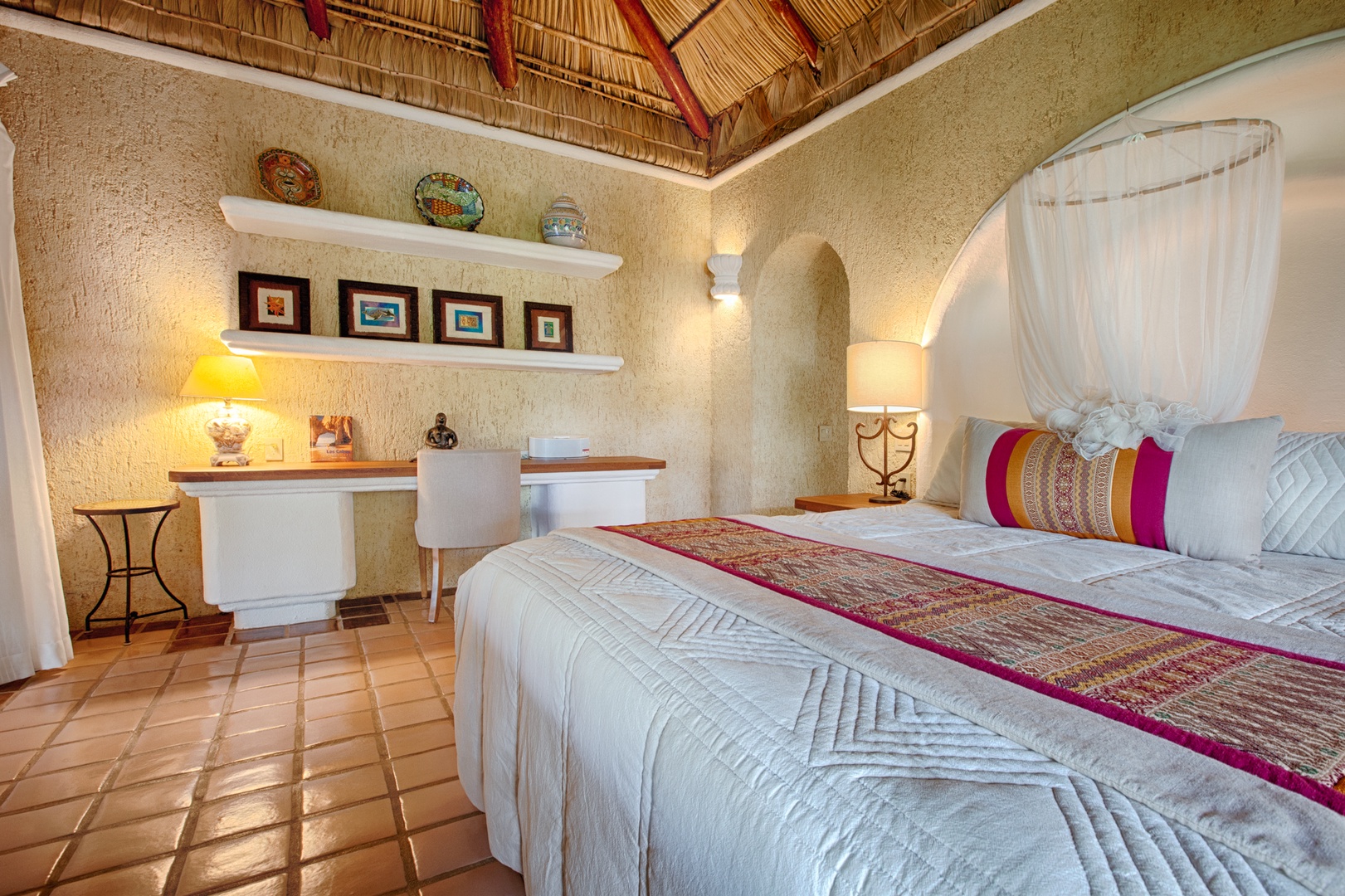 Drift into dreams beneath your private palapa ceiling, where authentic Mexican artistry meets luxury comfort in your tropical sanctuary.