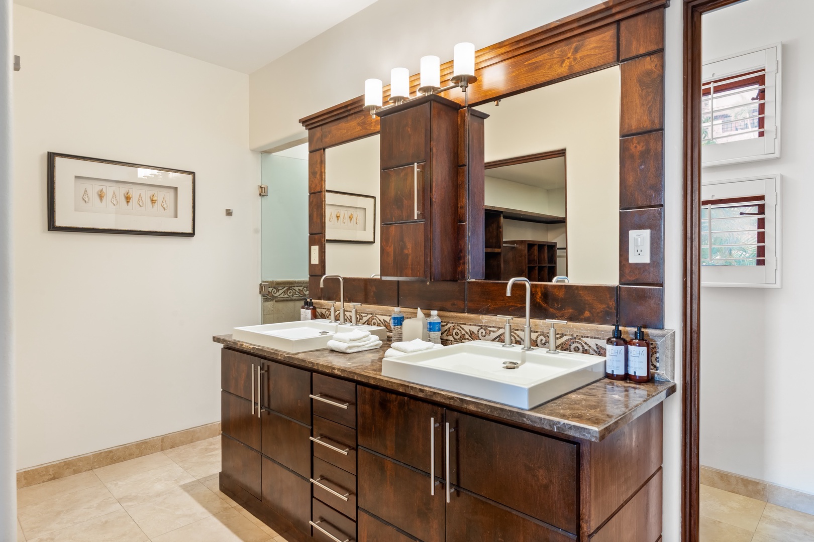 Your luxurious bathroom features dual vanities with marble countertops and premium toiletries, creating a spa-like retreat for your morning routine.