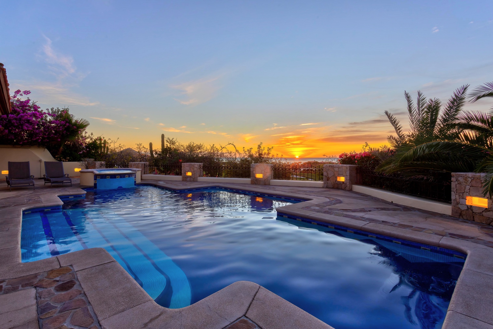 Spectacular sunset paints the sky as your private pool reflects the golden hues, creating the perfect evening ambiance.