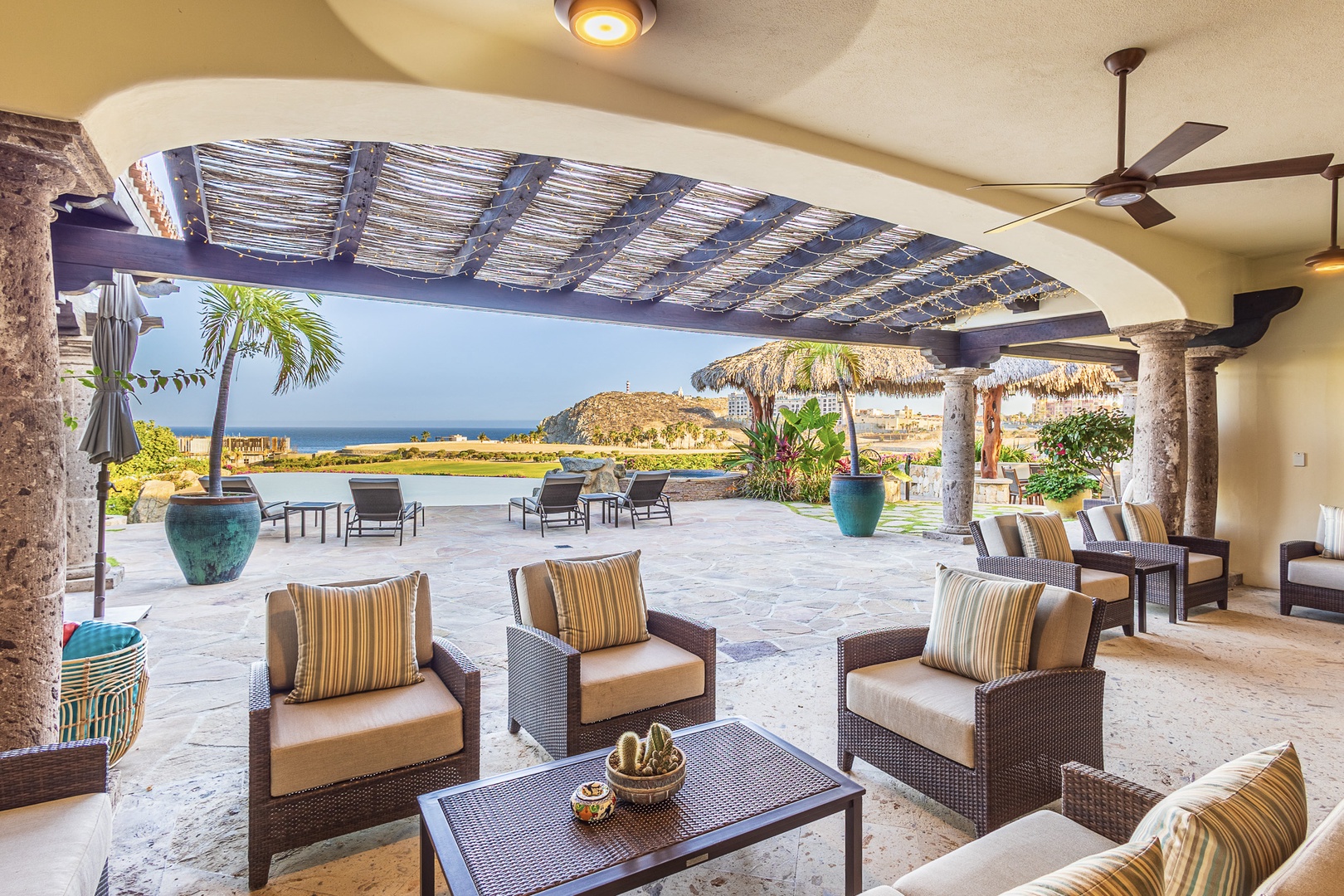 Relax under the shade of this open-air lounge, where ocean breezes and stunning sea views invite you to unwind in comfort.