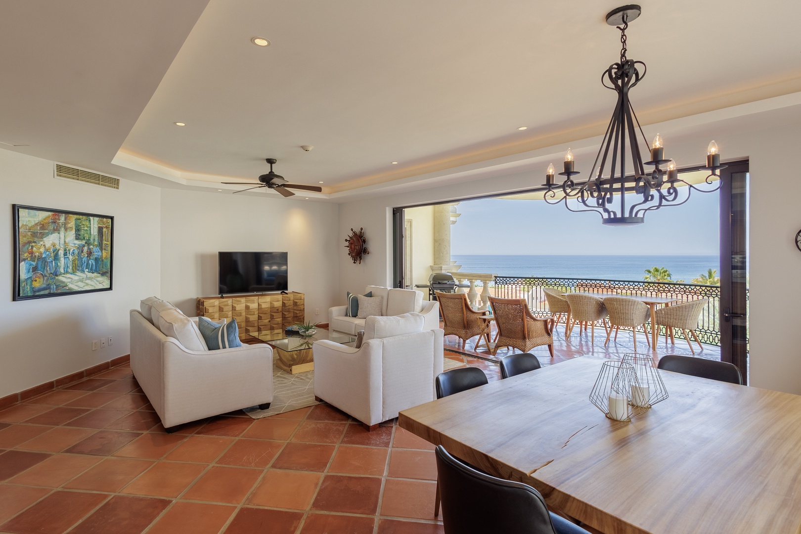 Picture yourself relaxing in this bright, open living space where the ocean stretches endlessly before you. With seamless indoor-outdoor flow, you'll enjoy stunning sea views from the comfort of your inviting seating area.