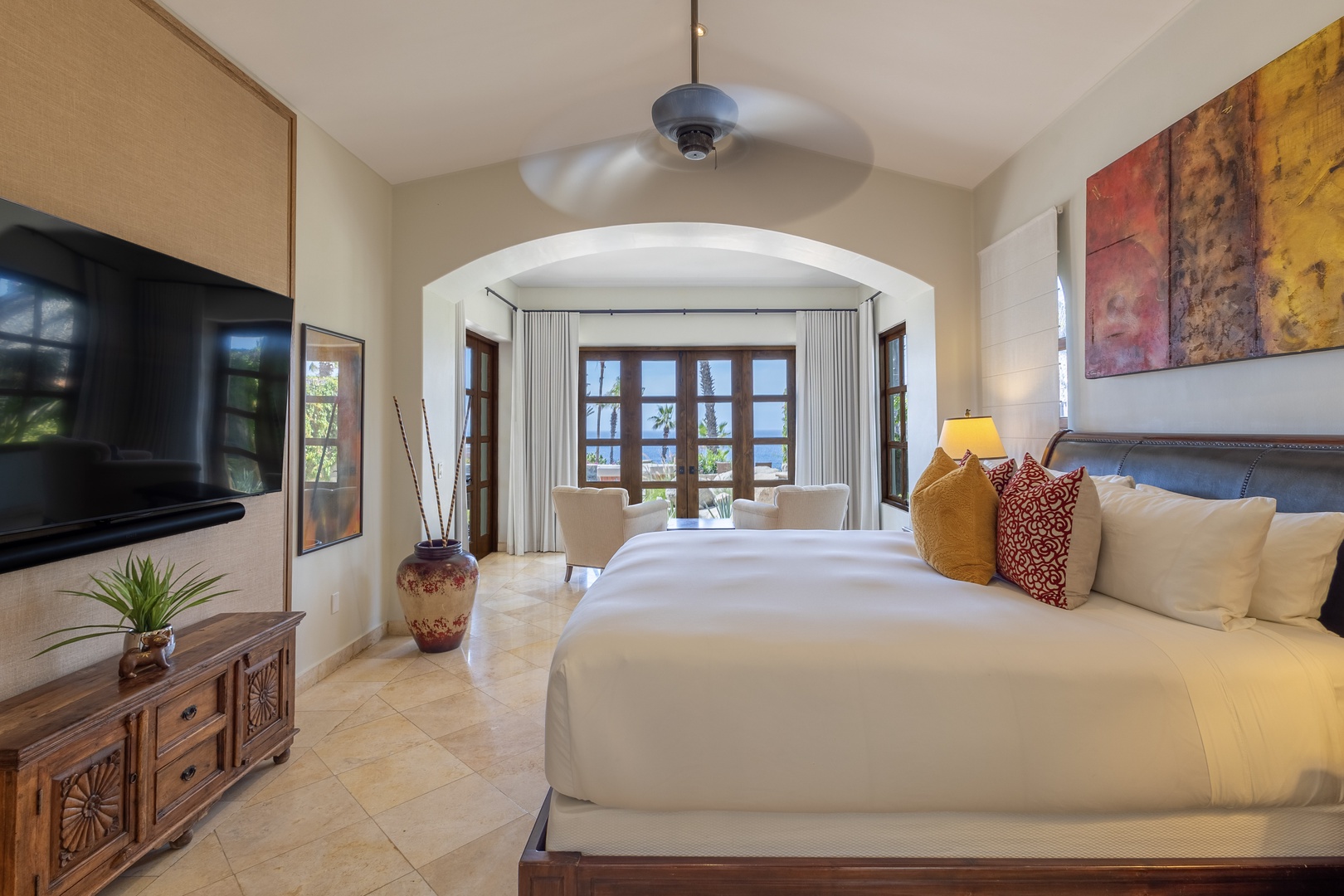 Rest peacefully in your elegantly appointed bedroom with warm tropical touches and scenic balcony views.