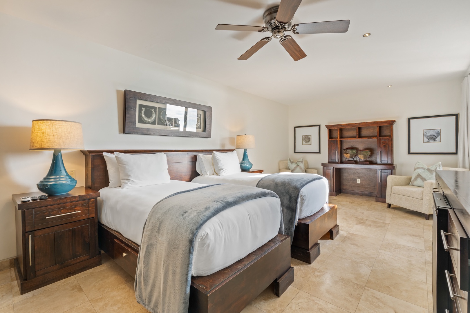 Unwind in your elegantly appointed bedroom, where rich wood furnishings and plush bedding create the perfect sanctuary for restful nights.