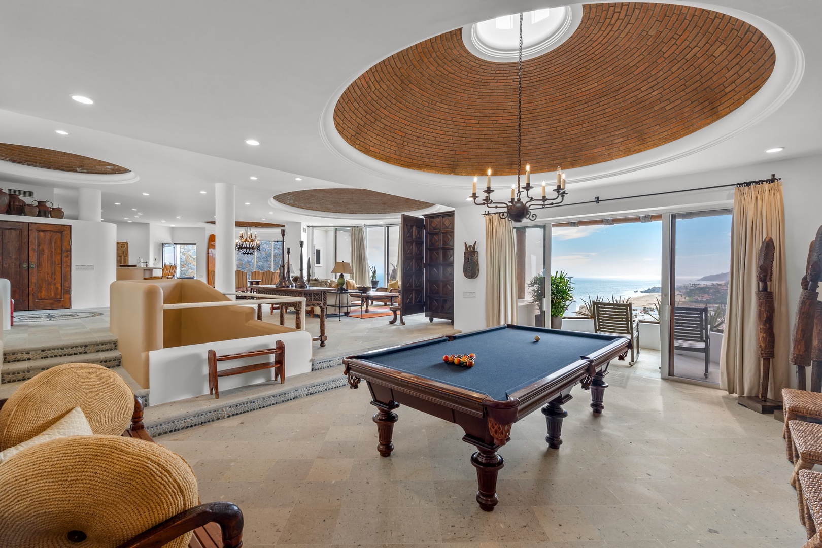 Challenge friends to a game at your own pool table in this stunning entertainment space with soaring ceilings and ocean views.