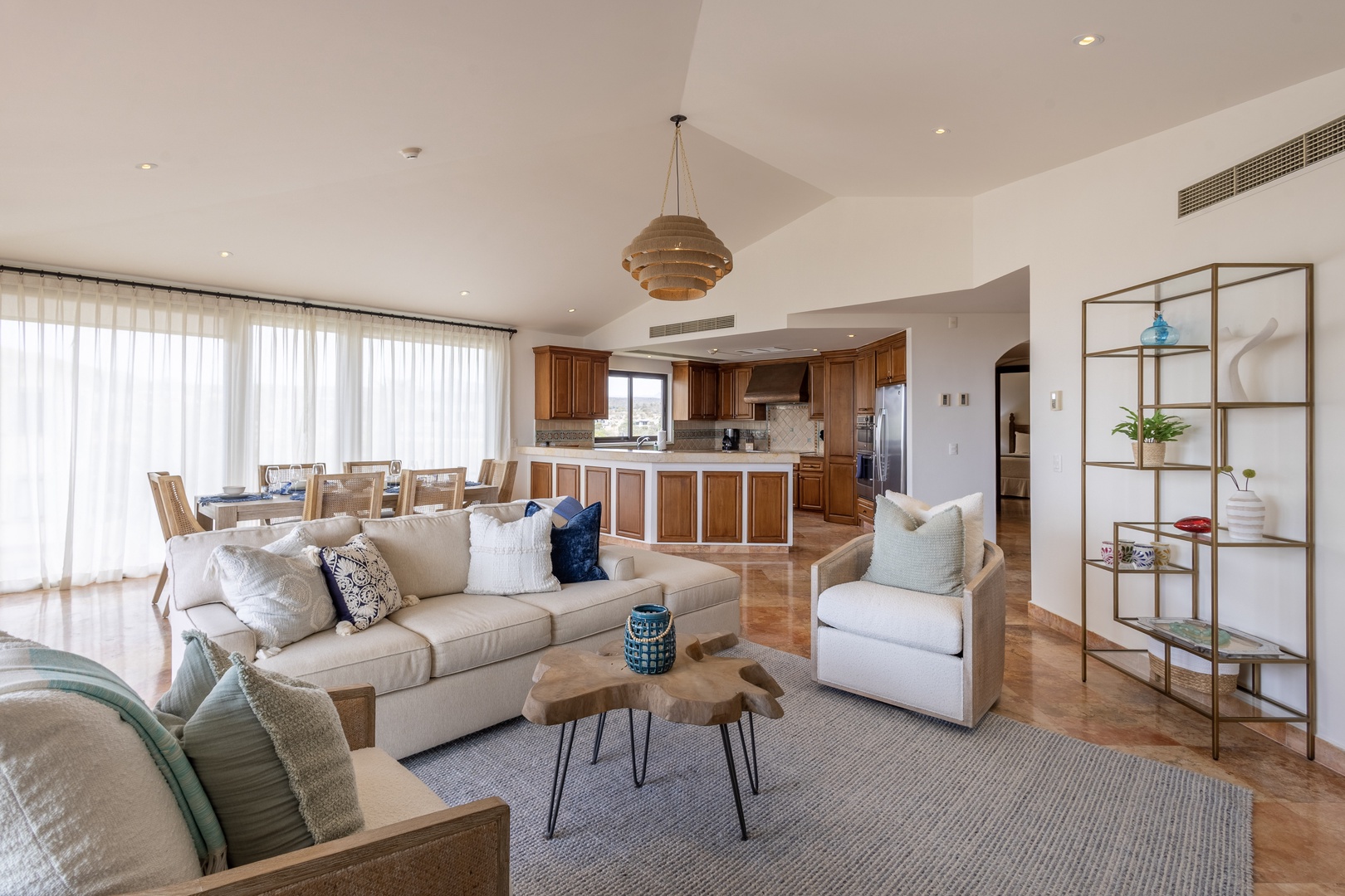 Relax in your spacious open-plan living area where modern comfort meets elegant design, perfect for unwinding after exploring.