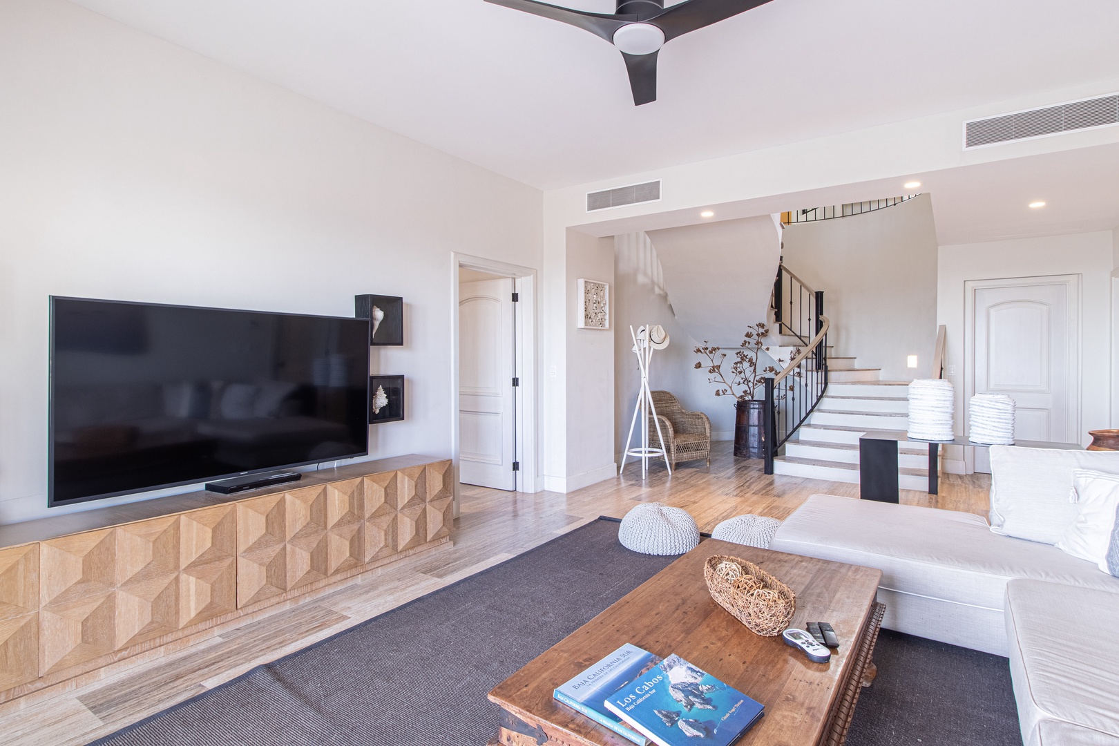 Your bright living space invites you to unwind with entertainment and style. Relax on plush seating while enjoying modern comfort, natural light, and elegant design touches throughout.
