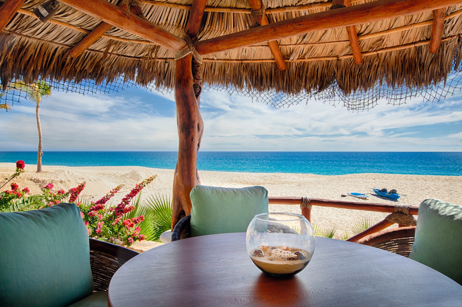 Unwind under your private palapa with turquoise waters stretching endlessly before you, creating the perfect beachfront sanctuary for relaxation.