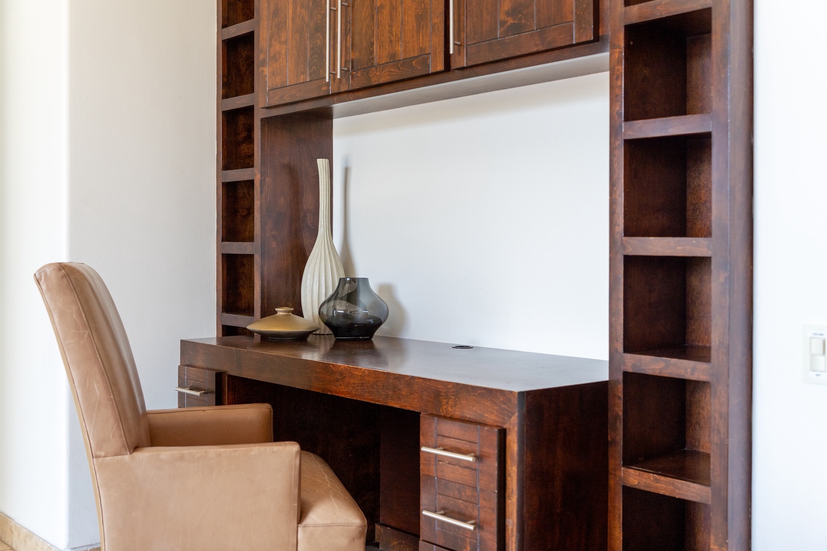 Your private workspace features rich wood finishes and thoughtful storage, creating the perfect spot for catching up on emails or planning adventures.