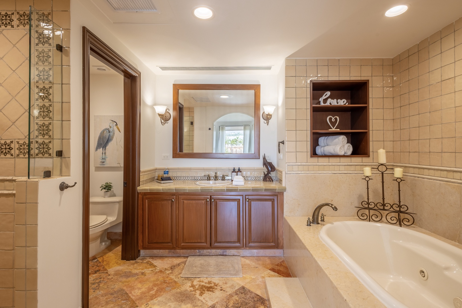Unwind in your elegant master bathroom with a luxurious soaking tub, dual vanities, and thoughtful touches like plush towels and decorative accents.