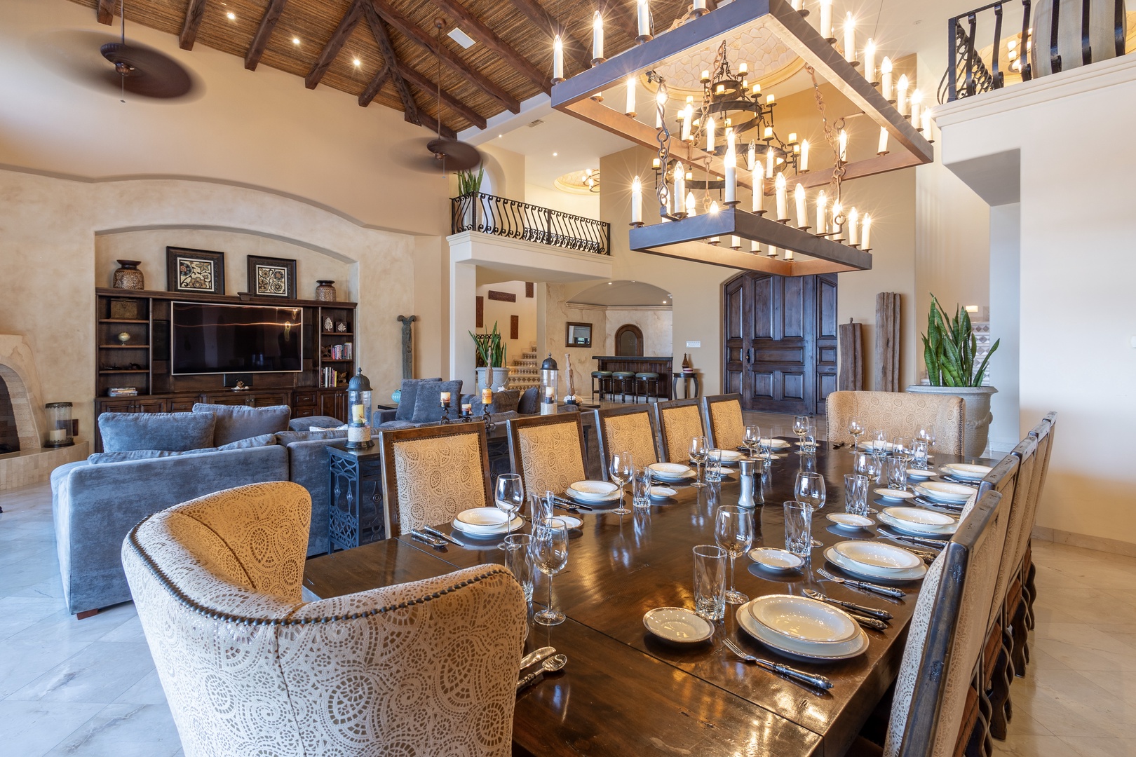 Gather your loved ones around this stunning dining table, where memorable meals await beneath elegant chandeliers. Your spacious living area flows seamlessly, inviting relaxation after days of exploration.