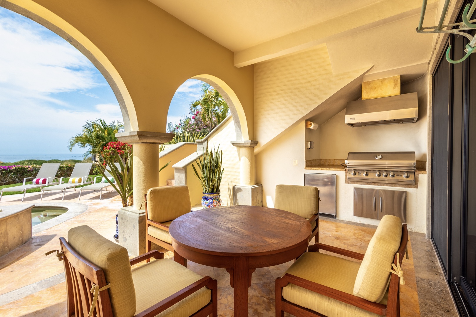 Your private outdoor dining oasis awaits with stunning ocean views, perfect for grilling fresh catch while enjoying warm breezes and tropical surroundings.
