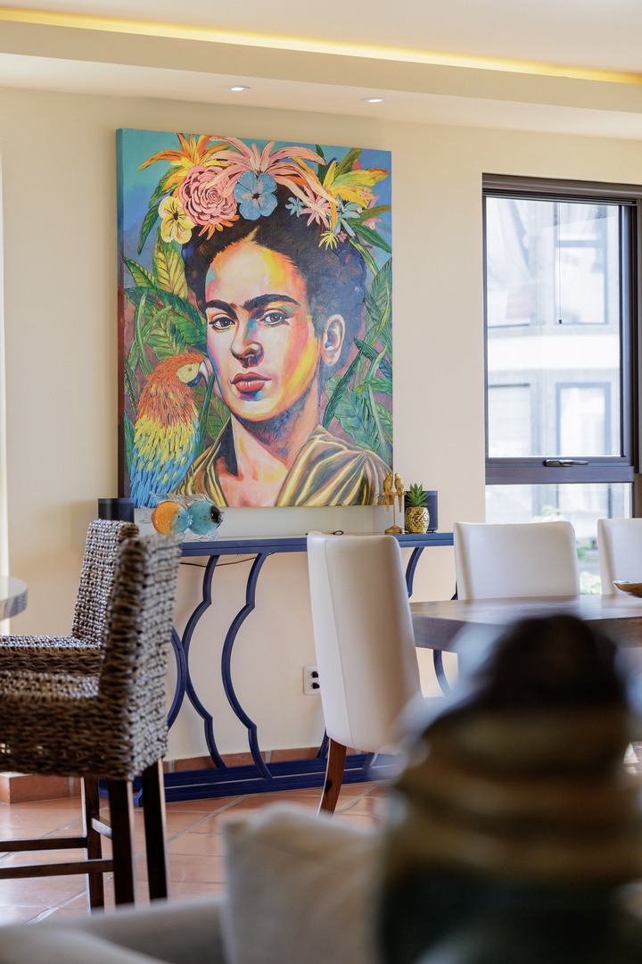 Your dining space features a striking art collection and plenty of natural light—perfect for sharing meals and making memories with loved ones.