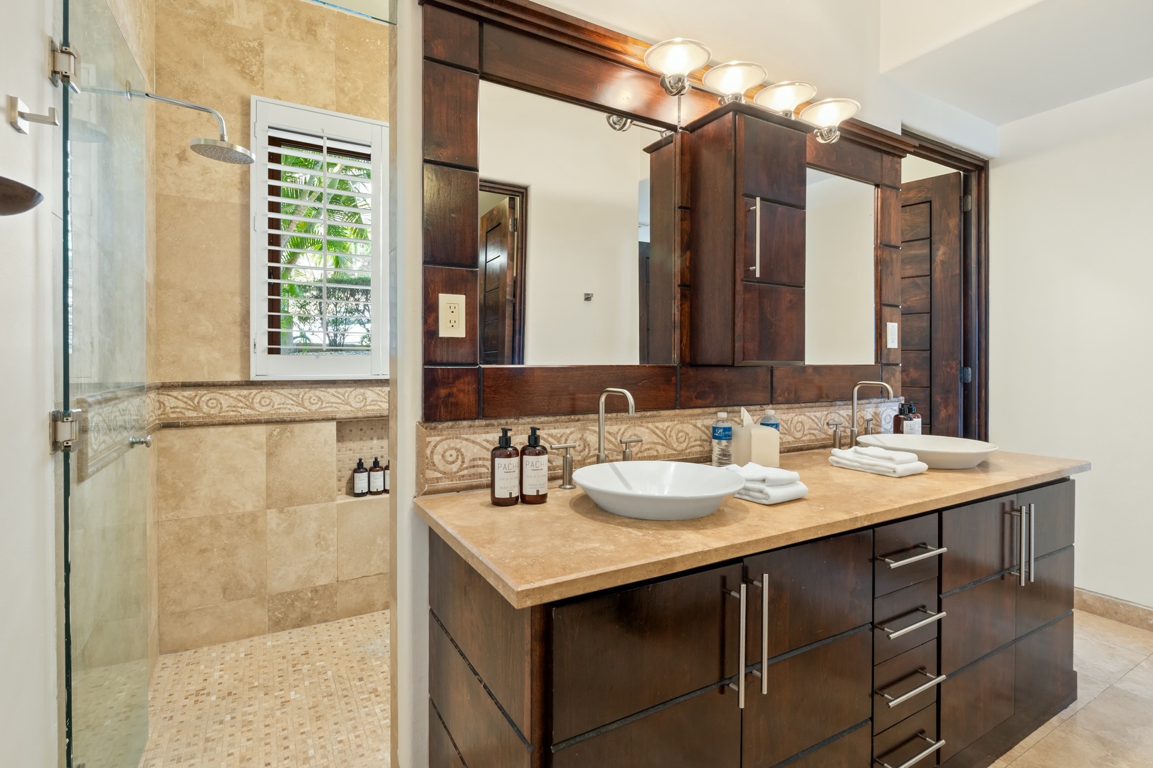 Luxurious bathroom with elegant double vanity, premium fixtures, and serene shower space for your ultimate relaxation.