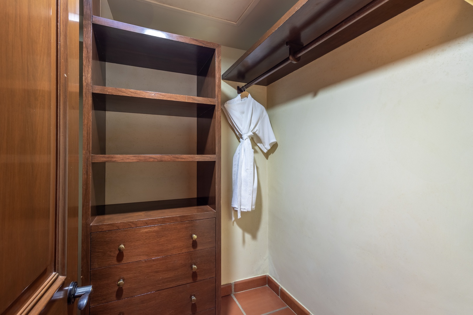 Unpack and settle in with ease. Your private closet features ample shelving, built-in drawers, and hanging space to keep your belongings organized throughout your stay.