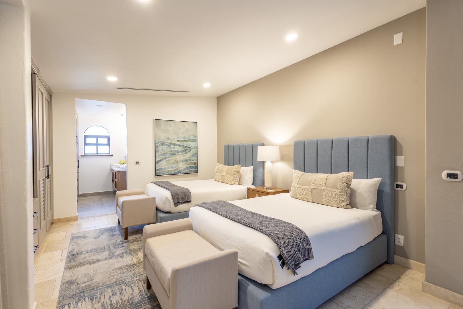 Sink into plush bedding and cozy textures in your serene bedroom retreat, designed for restful nights and peaceful mornings.