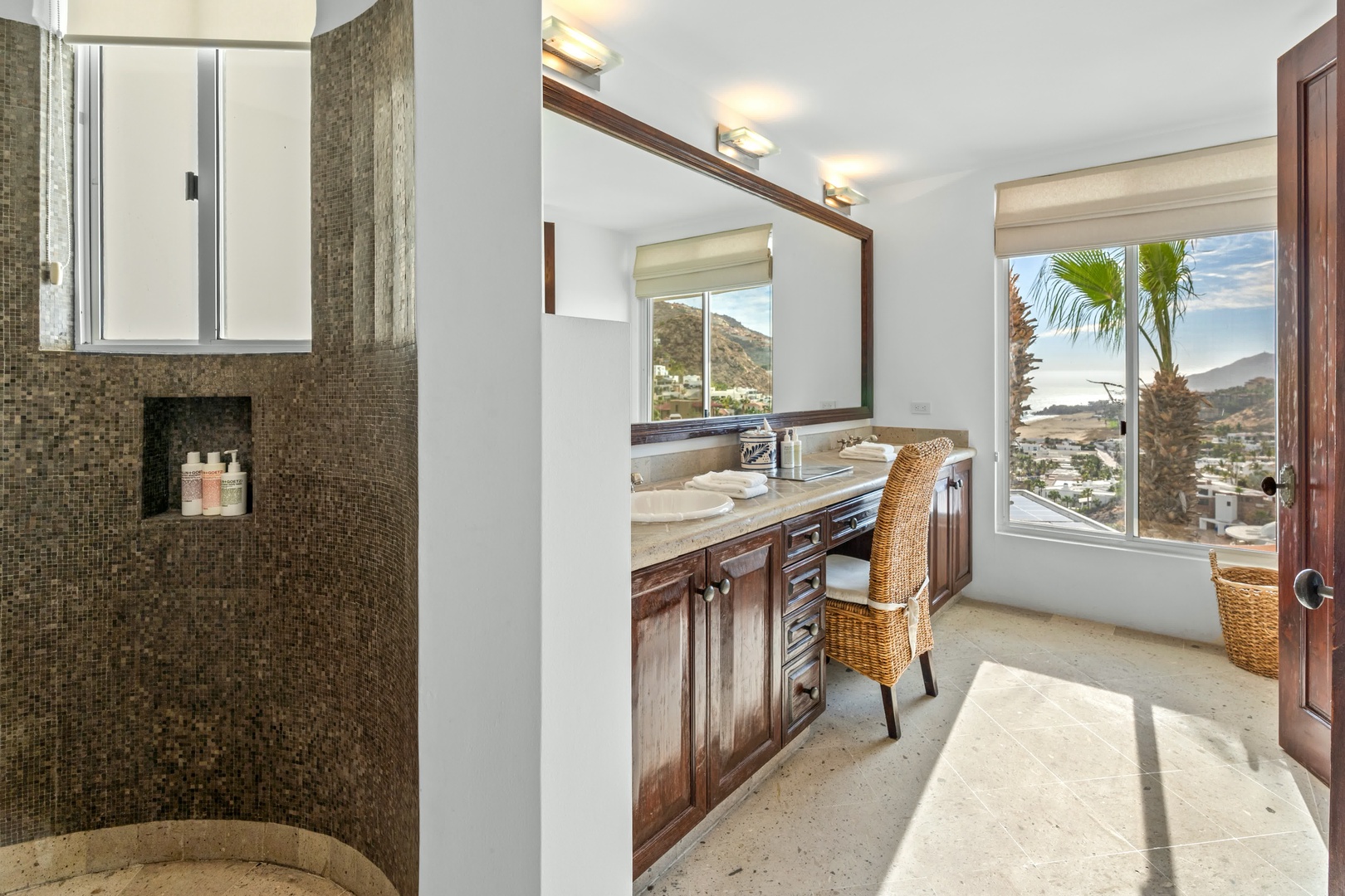 Pamper yourself in this elegant bathroom with stunning mountain views while you get ready for your day.