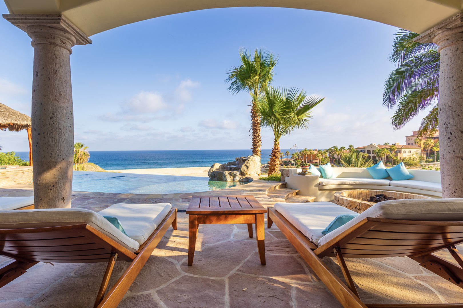 Lounge on your private terrace with breathtaking ocean views, refreshing pool steps away, and warm tropical breezes welcoming you to pure relaxation.
