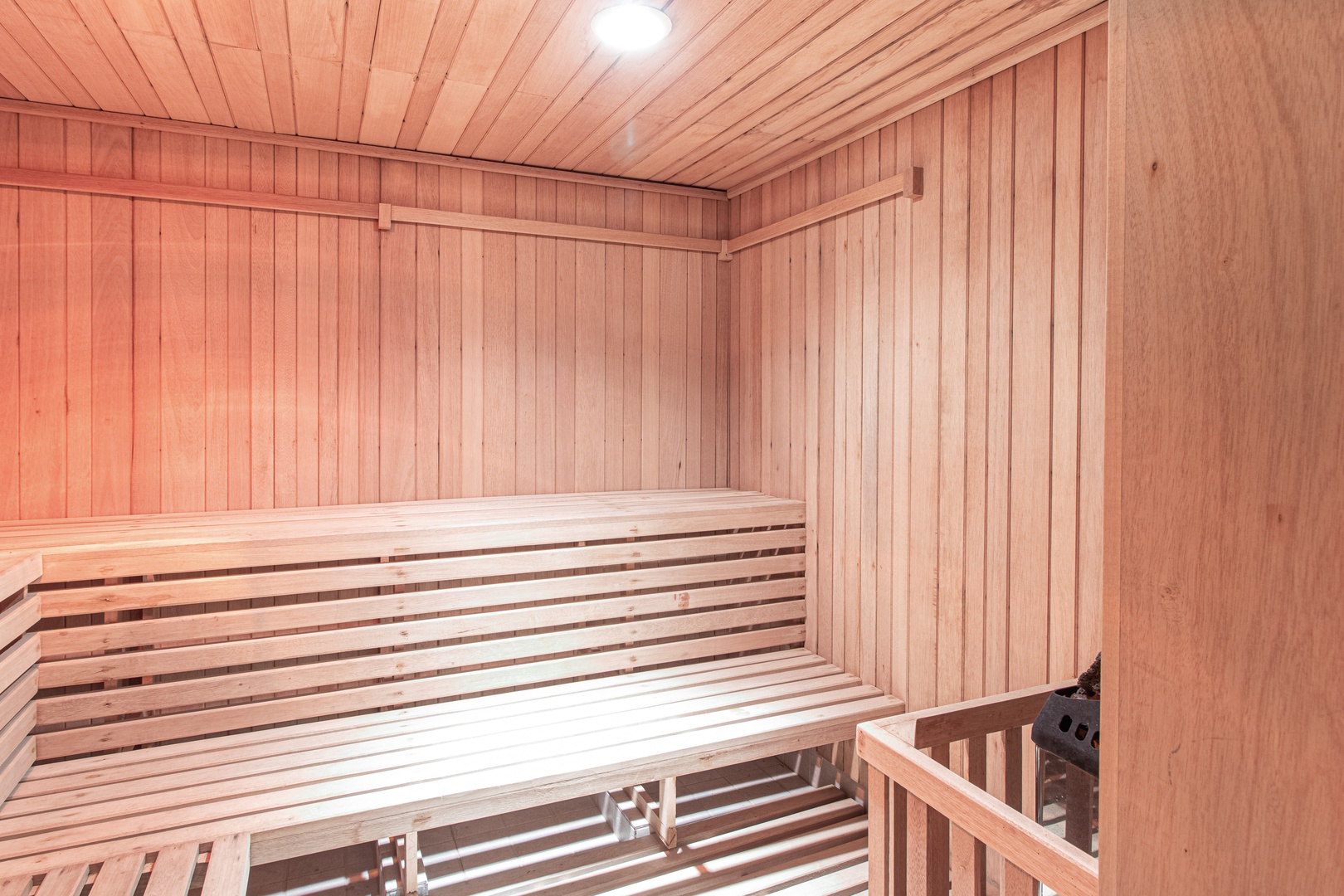 This beautifully crafted wooden sauna awaits your relaxation rituals, where warm cedar envelops you in soothing heat and the gentle glow creates your perfect wellness retreat.