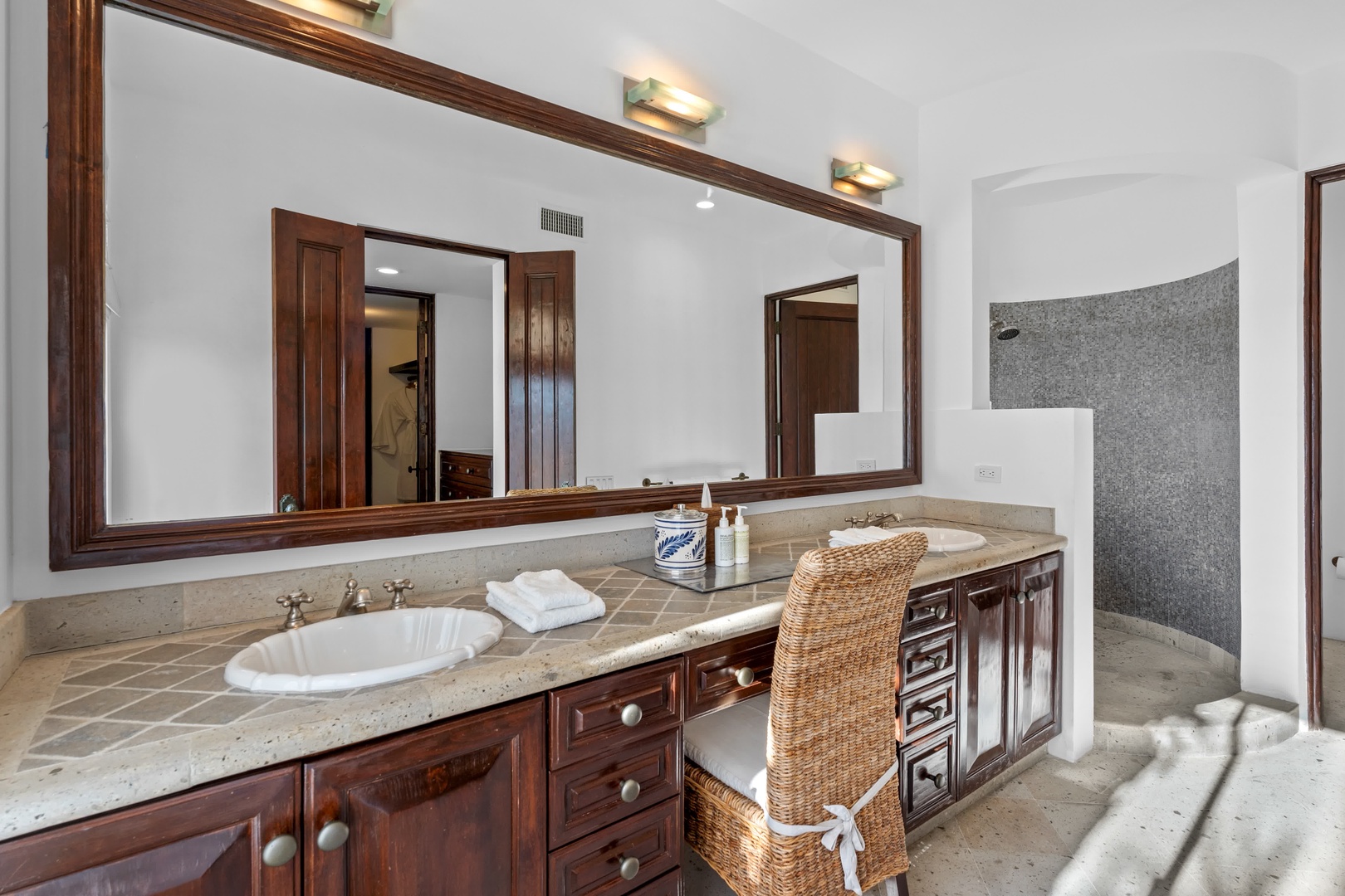 Indulge in your spacious master bathroom with dual vanities, elegant marble countertops, and thoughtful amenities for a luxurious morning routine.