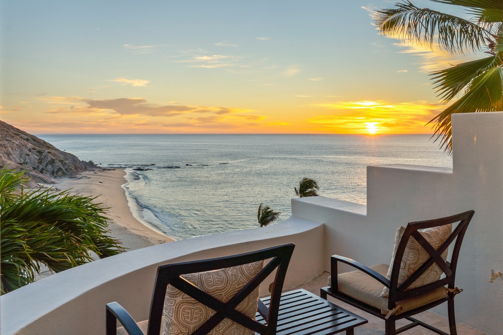 Your private balcony overlooks pristine sands and endless ocean, where golden sunsets paint the sky each evening.