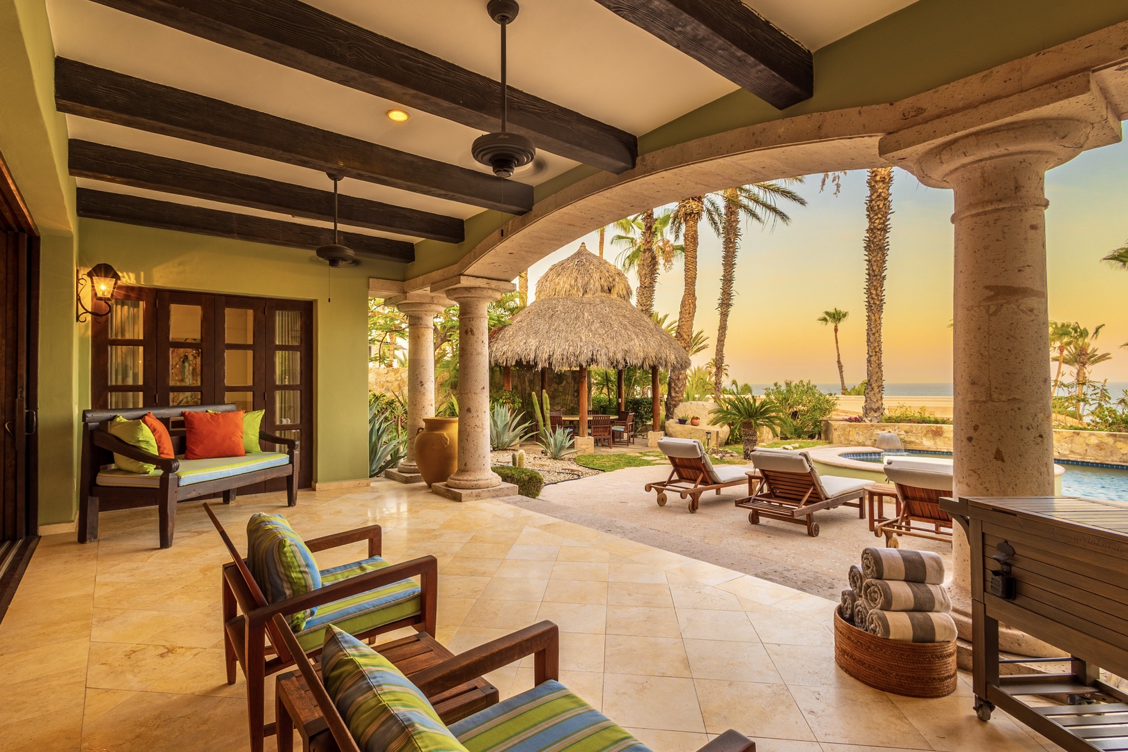 Sink into comfort on your covered terrace as warm ocean breezes drift through swaying palms and your private pool sparkles just steps away.