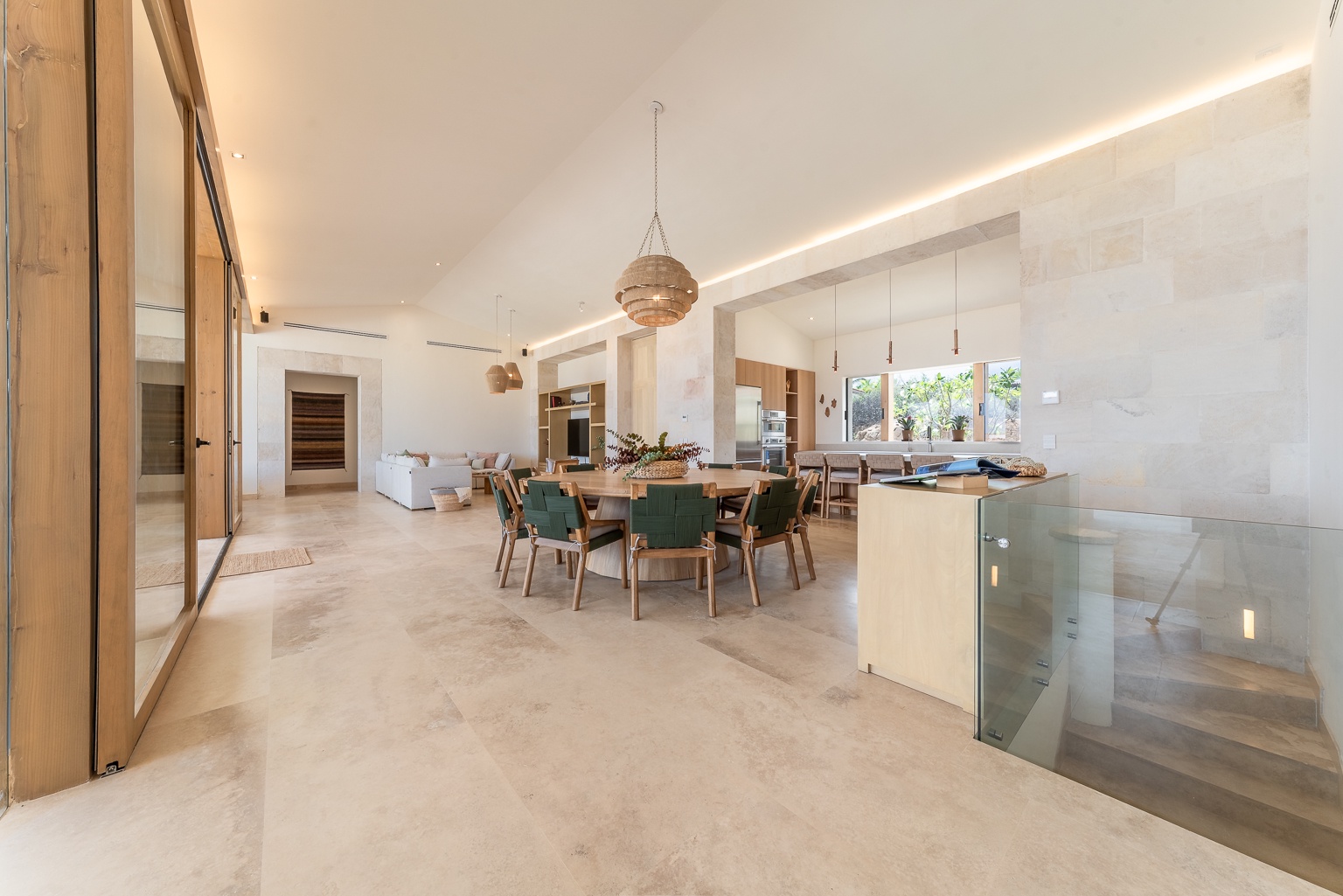 Step into your open-concept living space where natural light, soaring ceilings, and elegant design converge—your home away from home awaits with room to gather, dine, and unwind.