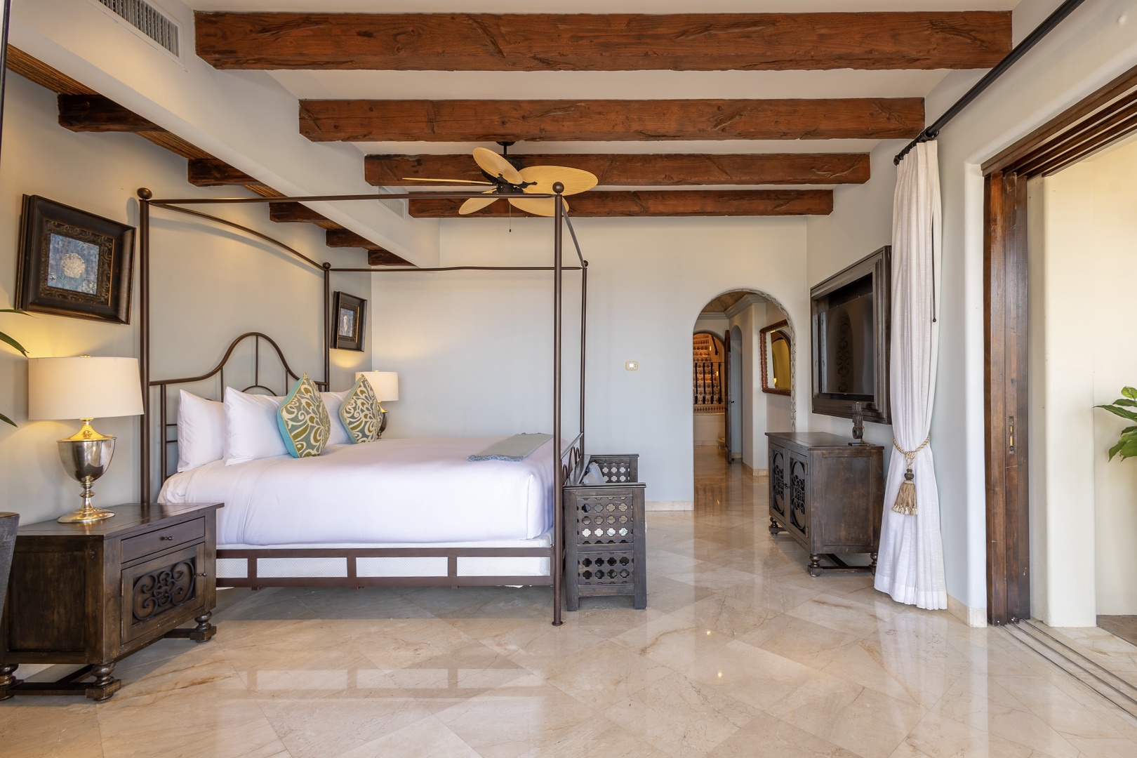 Sink into crisp linens under soaring beamed ceilings in your private sanctuary, where rustic elegance meets serene comfort for a truly restorative escape.