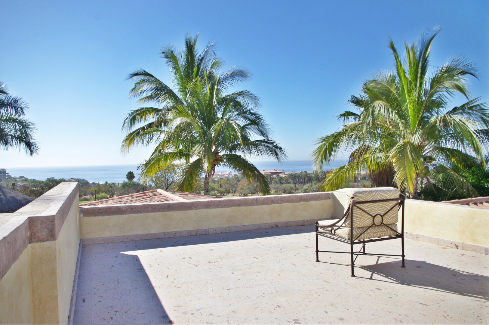 Soak up the sun from your private rooftop terrace, where swaying palms frame ocean views and the gentle breeze invites you to unwind in complete tranquility.