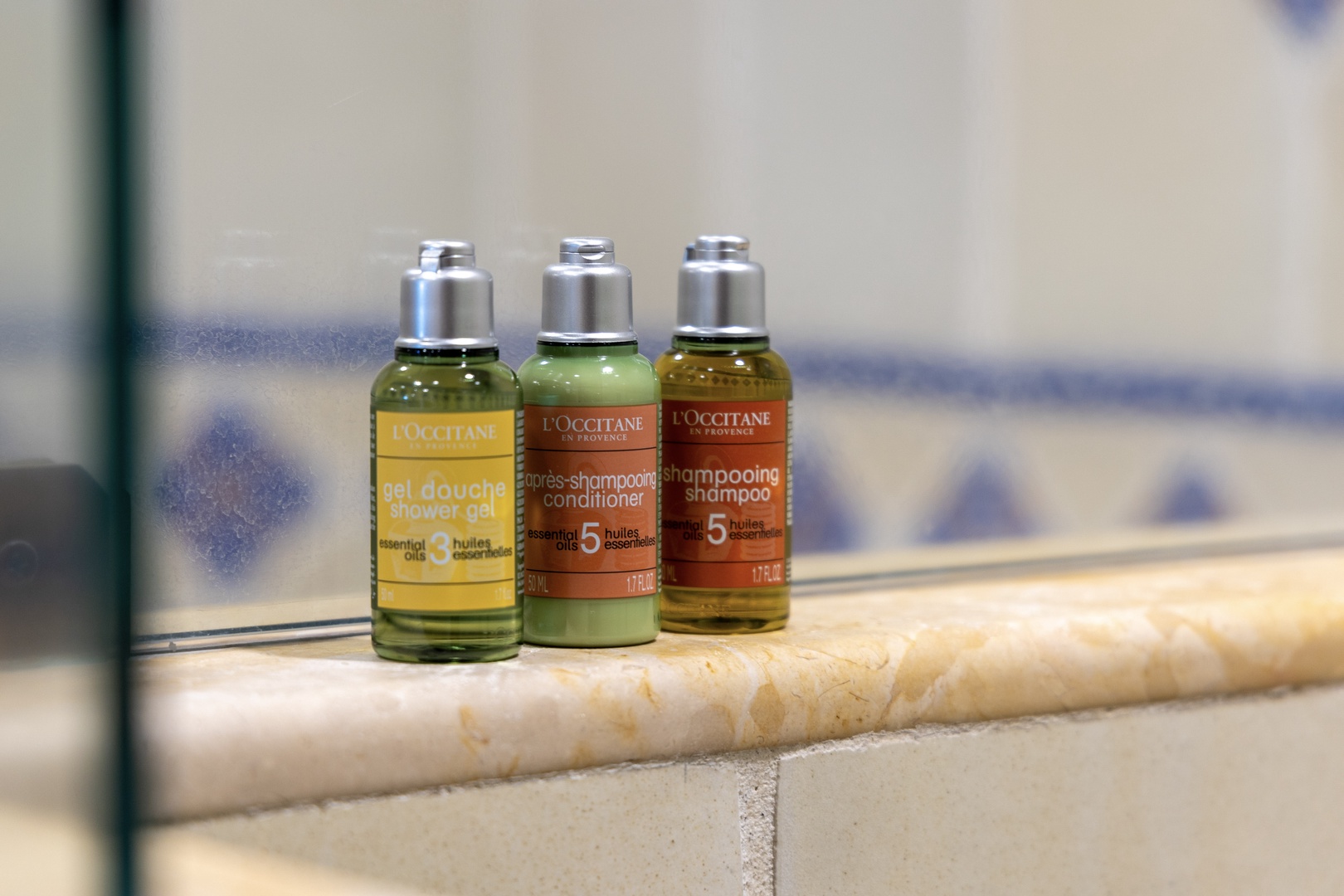 Premium toiletries await you—L'Occitane shower gel, shampoo, and conditioner to refresh and pamper during your stay.
