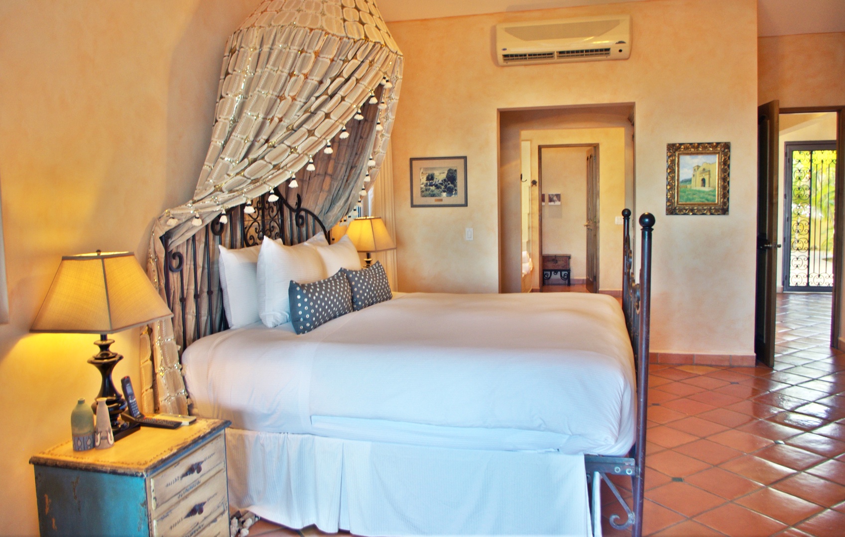 Sink into crisp linens and charming rustic details in your private retreat, complete with cooling air conditioning and warm ambient lighting for ultimate comfort.