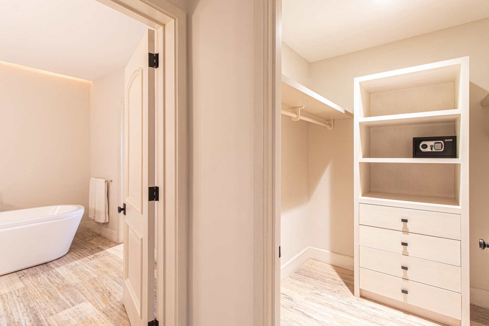 Step into your bright walk-in closet with built-in shelving and drawers, plus a secure safe for your valuables. Your spa-like ensuite awaits just beyond.