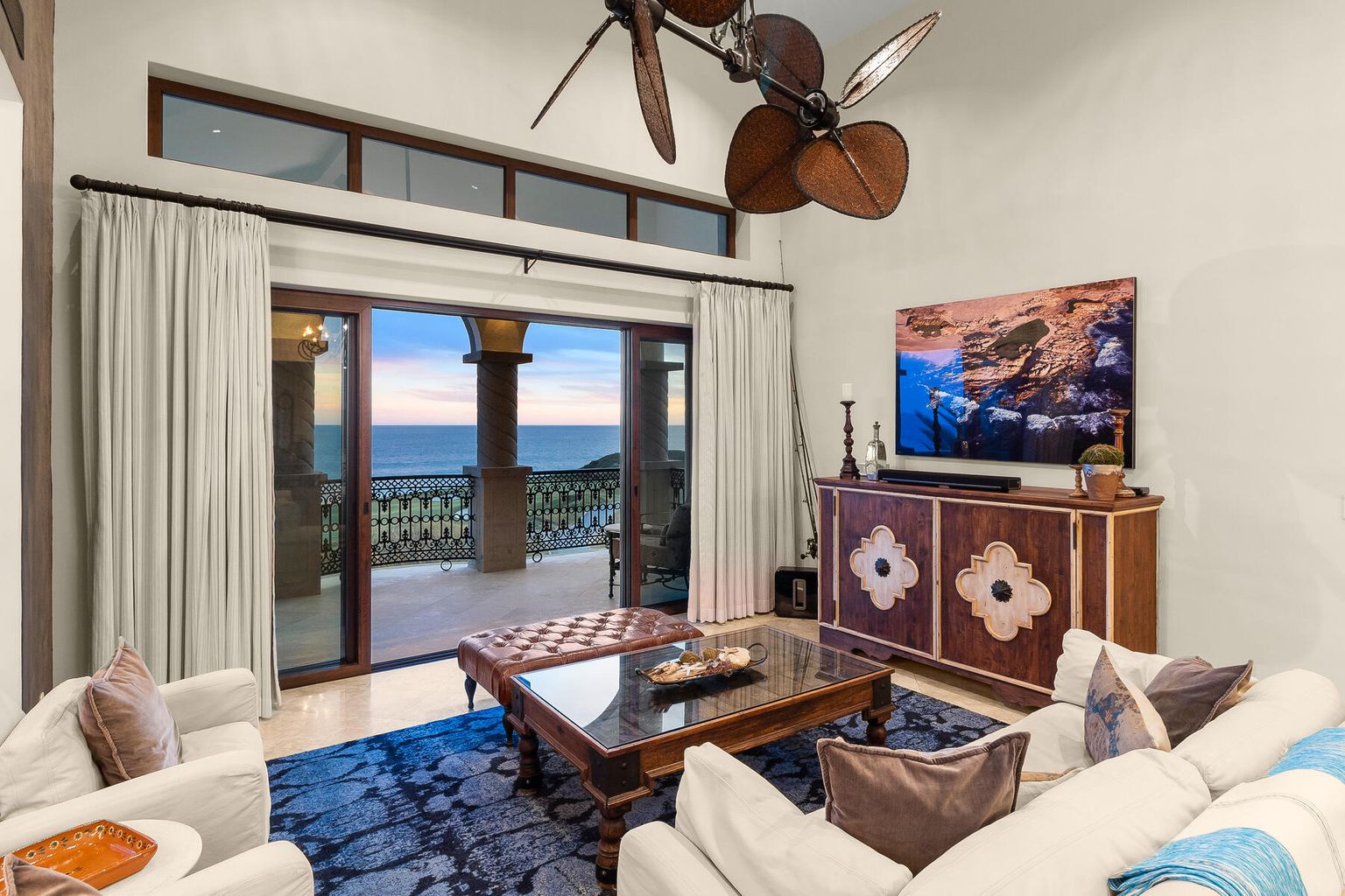 Sink into plush seating and let ocean breezes drift through, while your private balcony frames endless blue horizons. This living space invites you to unwind in effortless coastal elegance.